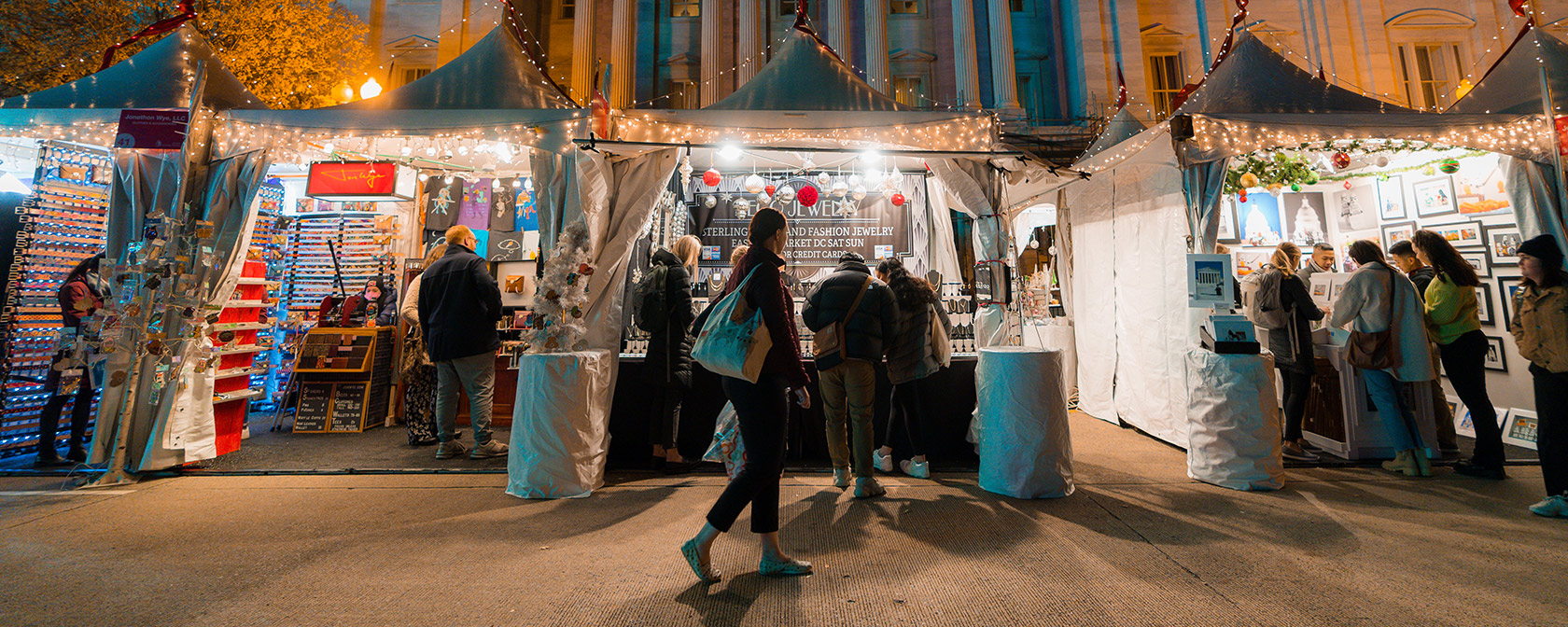 Downtown Holiday Market tents at night