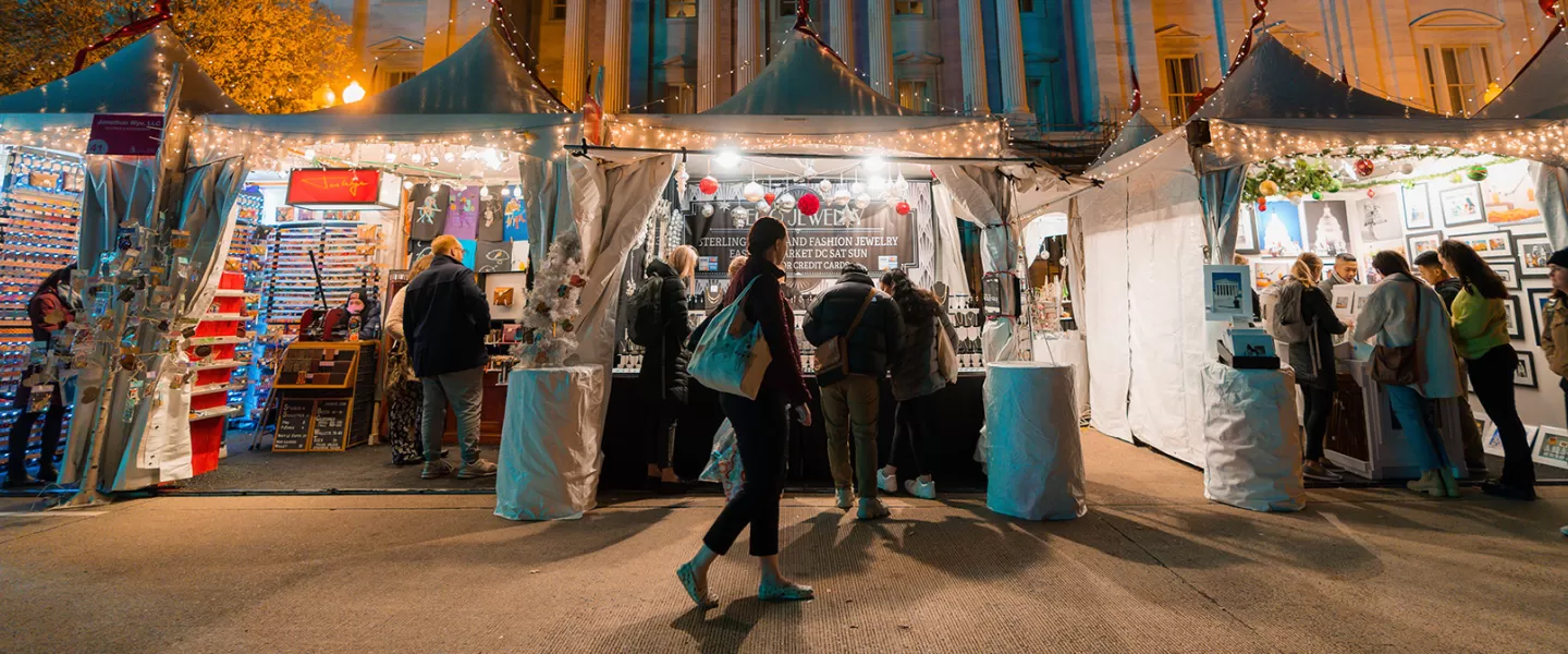 Downtown Holiday Market tents at night