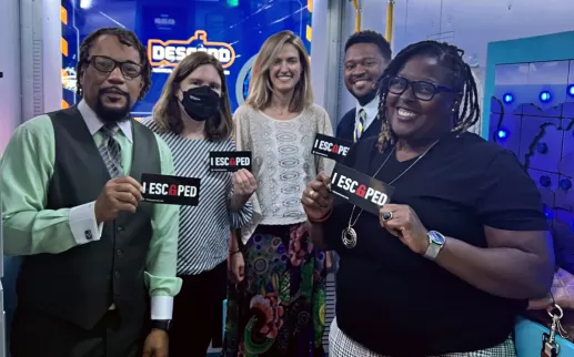 educators stand together after finishing an escape room
