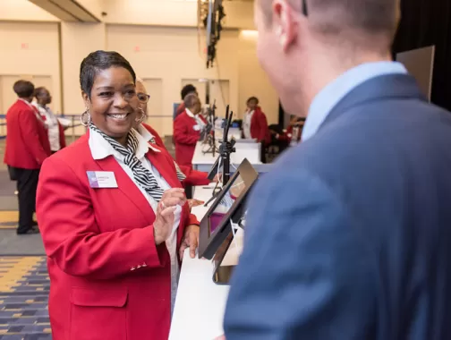 Destination DC Staffing Services redcoat assisting meeting or convention attendee at the Walter E. Washington Convention Center